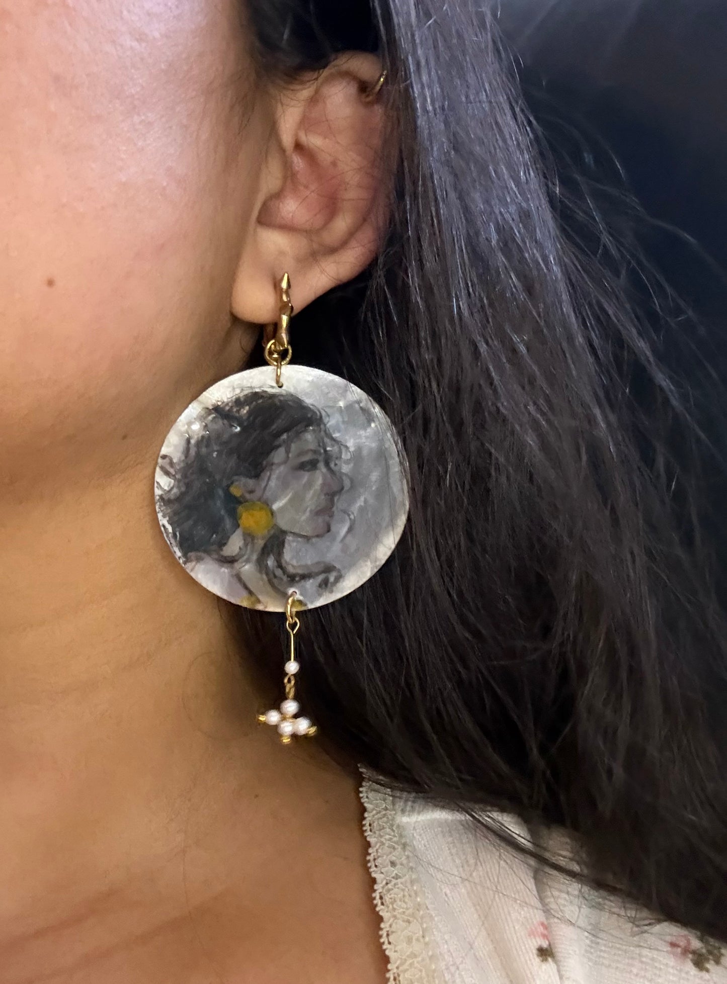 Girl with a earrings painted on a earring