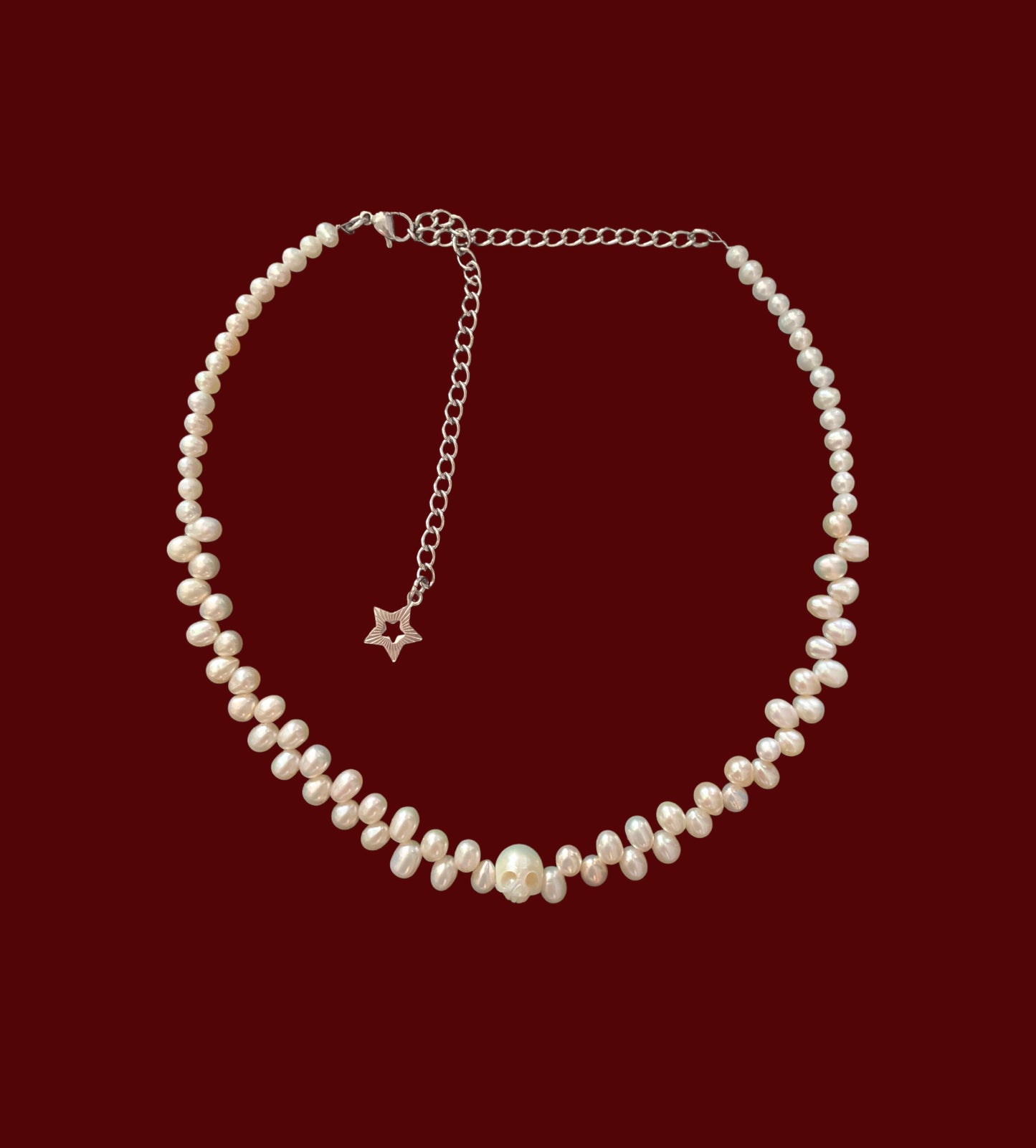 Carved skull pearl choker { freshwater cultured pearl}