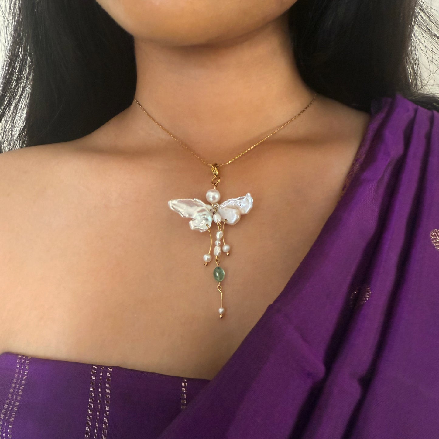 Butterfly charm necklace made with pearl