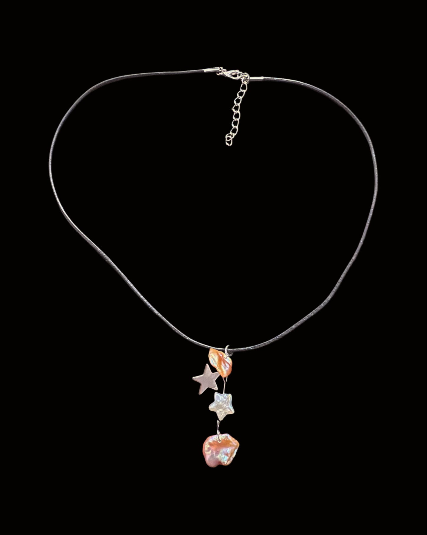 Scales of mermaid on black thread