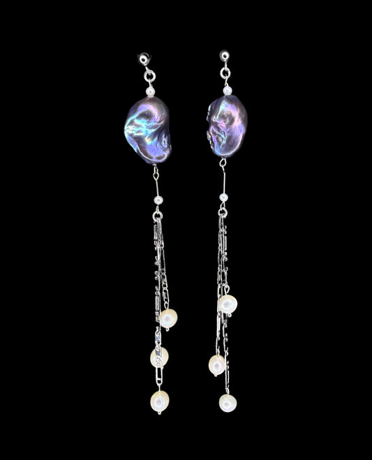 Space hiding in a sea rock earrings