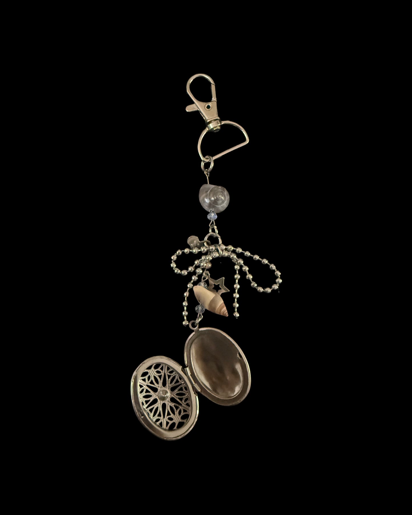 Carved dome pendent on bagcharm