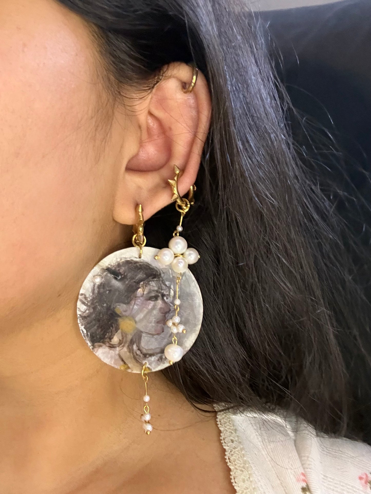 Girl with a earrings painted on a earring