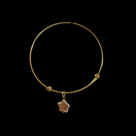 Gold bangle with purple flower