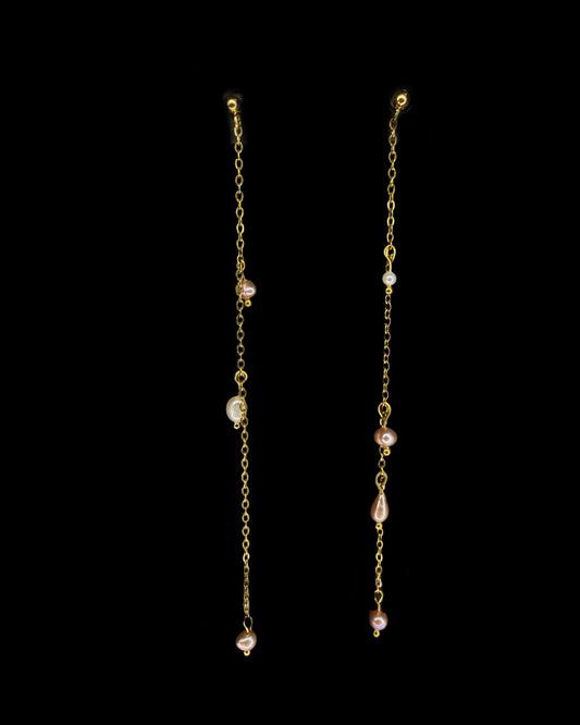 Dewy pearls dripping of a gold thread